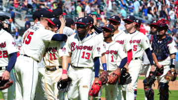 ATLANTA, GA - JULY 29: Sean Newcomb #15 of the Atlanta Braves is congratulated by Ender Inciarte #11 as teammates line up to greet Newcomb after throwing a one-hit game through 8 2/3 innings against the Los Angeles Dodgers at SunTrust Park on July 29, 2018 in Atlanta, Georgia. (Photo by Scott Cunningham/Getty Images)