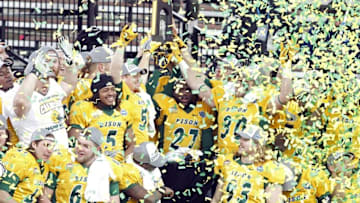 Jan 9, 2016; Frisco, TX, USA; North Dakota State Bison players hold up the championship trophy after the game against the Jacksonville State Gamecocks in the FCS Championship college football game at Toyota Stadium. North Dakota State won the championship 37-10. Mandatory Credit: Tim Heitman-USA TODAY Sports