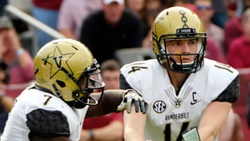 COLUMBIA, SC - OCTOBER 28: Running back Ralph Webb #7 of the Vanderbilt Commodores gets a handoff from Quarterback Kyle Shurmur #14 during their game against the South Carolina Gamecocks at Williams-Brice Stadium on October 28, 2017 in Columbia, South Carolina. (Photo by Todd Bennett/GettyImages)