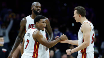 Kyle Lowry #7, Dewayne Dedmon #21 and Duncan Robinson #55 of the Miami Heat celebrate(Photo by Tim Nwachukwu/Getty Images)