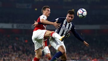 LONDON, ENGLAND - SEPTEMBER 25: Hal Robson-Kanu of West Bromwich Albion and Laurent Koscielny of Arsenal battle for the ball during the Premier League match between Arsenal and West Bromwich Albion at Emirates Stadium on September 25, 2017 in London, England. (Photo by Michael Steele/Getty Images)