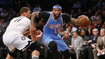 Feb 5, 2016; Brooklyn, NY, USA; Sacramento Kings center DeMarcus Cousins (15) drives to the basket against Brooklyn Nets center Brook Lopez (11) during the first half at Barclays Center. Mandatory Credit: Noah K. Murray-USA TODAY Sports