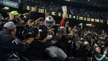 Nov 20, 2014; Oakland, CA, USA; Oakland Raiders running back Latavius Murray (28) celebrates with fans after scoring on an 11-yard touchdown run in the first quarter against the Kansas City Chiefs at O.co Coliseum. Mandatory Credit: Kirby Lee-USA TODAY Sports