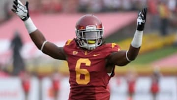 Oct 26, 2013; Los Angeles, CA, USA; USC Trojans safety Josh Shaw (6) tries to get the crowd going during the third quarter of the Trojans 19-3 win over the Utah Utes at Los Angeles Memorial Coliseum. Mandatory Credit: Robert Hanashiro-USA TODAY Sports
