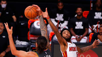 LAKE BUENA VISTA, FLORIDA - AUGUST 12: Steven Adams #12 of the Oklahoma City Thunder catches a pass against Derrick Jones Jr. #5 of the Miami Heat during the third quarter at Visa Athletic Center at ESPN Wide World Of Sports Complex on August 12, 2020 in Lake Buena Vista, Florida. NOTE TO USER: User expressly acknowledges and agrees that, by downloading and or using this photograph, User is consenting to the terms and conditions of the Getty Images License Agreement. (Photo by Kevin C. Cox/Getty Images)
