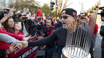 WASHINGTON, DC - NOVEMBER 02: Washington Nationals general manager Mike Rizzo holds the Commissioner's Trophy as he celebrates with fans during a parade to celebrate the Washington Nationals World Series victory over the Houston Astros on November 2, 2019 in Washington, DC. This is the first World Series win for the Nationals in 95 years. (Photo by Patrick McDermott/Getty Images)