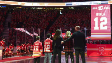 (EDITORS NOTE: caption correction) Mar 2, 2019; Calgary, Alberta, CAN; Calgary Flames former captain Jarome Iginla and his family watch his banner being raised to the rafters in a ceremony to retire his jersey before the Calgary Flames take on the Minnesota Wild at Scotiabank Saddledome. Mandatory Credit: Candice Ward-USA TODAY Sports