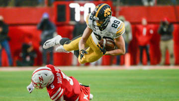 LINCOLN, NE - NOVEMBER 29: Cornerback Cam Taylor-Britt #5 of the Nebraska Cornhuskers upends wide receiver Nico Ragaini #89 of the Iowa Hawkeyes at Memorial Stadium on November 29, 2019 in Lincoln, Nebraska. (Photo by Steven Branscombe/Getty Images)