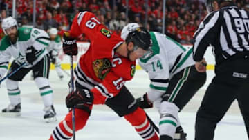 Feb 11, 2016; Chicago, IL, USA; Chicago Blackhawks center Jonathan Toews (19) and Dallas Stars left wing Jamie Benn (14) fight for a face off during the second period at the United Center. Mandatory Credit: Dennis Wierzbicki-USA TODAY Sports