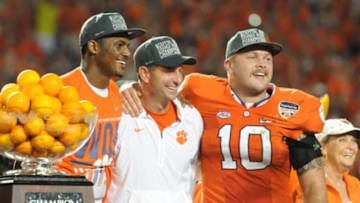 Dec 31, 2015; Miami Gardens, FL, USA; Clemson Tigers head coach Dabo Swinney celebrates with linebacker Ben Boulware (10) and quarterback Deshaun Watson (4) after defeating the Oklahoma Sooners in the 2015 CFP semifinal at the Orange Bowl at Sun Life Stadium. Clemson won 37-17. Mandatory Credit: Robert Duyos-USA TODAY Sports