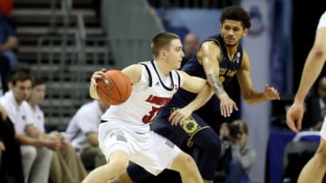 CHARLOTTE, NORTH CAROLINA - MARCH 13: Ryan McMahon #30 of the Louisville Cardinals dribbles the ball against Prentiss Hubb #3 of the Notre Dame Fighting Irish during their game in the second round of the 2019 Men's ACC Basketball Tournament at Spectrum Center on March 13, 2019 in Charlotte, North Carolina. (Photo by Streeter Lecka/Getty Images)