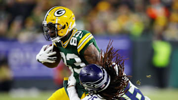 GREEN BAY, WISCONSIN - JANUARY 12: Shaquill Griffin #26 of the Seattle Seahawks attempts to tackle Marquez Valdes-Scantling #83 of the Green Bay Packers during the first half in the NFC Divisional Playoff game at Lambeau Field on January 12, 2020 in Green Bay, Wisconsin. (Photo by Gregory Shamus/Getty Images)