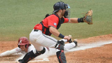 Alabama base runner Caden Rose (7) dives safely into home plate with a run against Ole Miss at Sewell-Thomas Stadium Friday, May 19, 2023, in the final home series of the season.