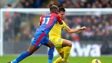 LONDON, ENGLAND - DECEMBER 30: Wilfried Zaha of Crystal Palace is challenged by Cesar Azpilicueta of Chelsea during the Premier League match between Crystal Palace and Chelsea FC at Selhurst Park on December 30, 2018 in London, United Kingdom. (Photo by Jordan Mansfield/Getty Images)