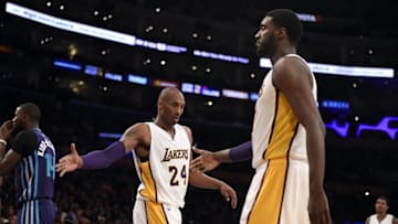 Jan 31, 2016; Los Angeles, CA, USA; Los Angeles Lakers forward Kobe Bryant (24) celebrates with Los Angeles Lakers center Roy Hibbert (17) during the third quarter against the Charlotte Hornets at Staples Center. Mandatory Credit: Richard Mackson-USA TODAY Sports