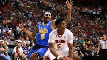 March 13, 2015; Las Vegas, NV, USA; Arizona Wildcats forward Stanley Johnson (5, right) drives to the basket against UCLA Bruins forward Kevon Looney (5) during the first half in the semifinal round of the Pac-12 Conference tournament at MGM Grand Garden Arena. Mandatory Credit: Kyle Terada-USA TODAY Sports