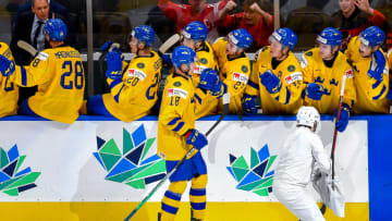 EDMONTON, AB - AUGUST 20: Linus Sjodin #18 of Sweden skates by the bench to celebrate with teammates following his third period goal against Czechia during the 2022 IIHF World Junior Championship bronze medal game at Rogers Place on August 20, 2022 in Edmonton, Alberta, Canada. (Photo by Andy Devlin/Getty Images)