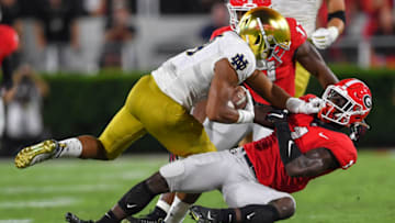 Sep 21, 2019; Athens, GA, USA; Georgia Bulldogs defensive back Divaad Wilson (1) tackles Notre Dame Fighting Irish wide receiver Kevin Austin Jr. (4) during the first half at Sanford Stadium. Mandatory Credit: Dale Zanine-USA TODAY Sports