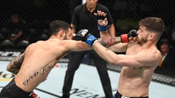ATLANTA, GA - APRIL 13: (L-R) Brandon Davis punches Randy Costa in their bantamweight bout during the UFC 236 event at State Farm Arena on April 13, 2019 in Atlanta, Georgia. (Photo by Josh Hedges/Zuffa LLC/Zuffa LLC via Getty Images)