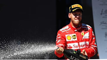 SAO PAULO, BRAZIL - NOVEMBER 12: Race winner Sebastian Vettel of Germany and Ferrari celebrates on the podium during the Formula One Grand Prix of Brazil at Autodromo Jose Carlos Pace on November 12, 2017 in Sao Paulo, Brazil. (Photo by Mark Thompson/Getty Images)