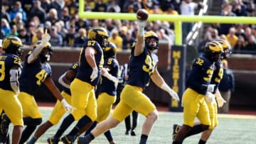 Michigan Wolverines defensive end Aidan Hutchinson (97) celebrates recovering a fumble against the Northwestern Wildcats during the second half Saturday, Oct. 23, 2021 at Michigan Stadium.Mich Nw