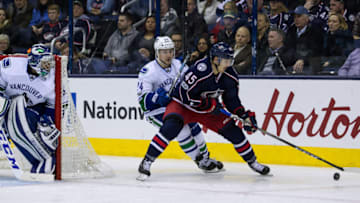 COLUMBUS, OH - FEBRUARY 09: Columbus Blue Jackets Center Lukas Sedlak (45) controls the puck away from Vancouver Canucks Left Wing Reid Boucher (24) during a regular season game between the Columbus Blue Jackets and Vancouver Canucks on February 09, 2017, at Nationwide Arena in Columbus, OH. The Columbus Blue Jackets lost 3-0 to the Vancouver Canucks. (Photo by Michael Griggs/Icon Sportswire via Getty Images)
