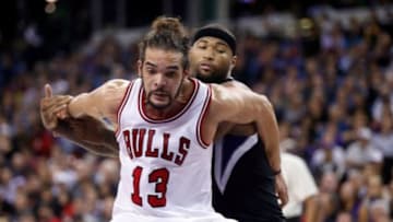 Nov 20, 2014; Sacramento, CA, USA; Chicago Bulls center Joakim Noah (13) boxes out against Sacramento Kings center DeMarcus Cousins (15) on a free throw during the fourth quarter at Sleep Train Arena. The Sacramento Kings defeated the Chicago Bulls 103-88. Mandatory Credit: Kelley L Cox-USA TODAY Sports