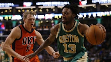 Mar 16, 2016; Boston, MA, USA; Boston Celtics guard James Young (13) drives the ball against Oklahoma City Thunder forward Kyle Singler (5) in the second half at TD Garden. Oklahoma City Thunder defeated the Celtics 130-109. Mandatory Credit: David Butler II-USA TODAY Sports