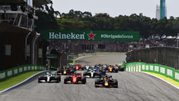 SAO PAULO, BRAZIL - NOVEMBER 17: Max Verstappen of the Netherlands driving the (33) Aston Martin Red Bull Racing RB15 leads the field into turn one at the start during the F1 Grand Prix of Brazil at Autodromo Jose Carlos Pace on November 17, 2019 in Sao Paulo, Brazil. (Photo by Mark Thompson/Getty Images)