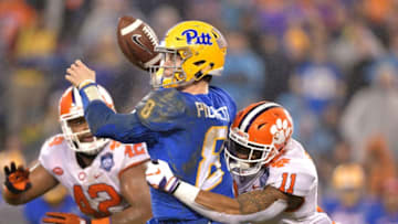 CHARLOTTE, NC - DECEMBER 01: Isaiah Simmons #11 of the Clemson Tigers forces a fumble by Kenny Pickett #8 of the Pittsburgh Panthers during their game at Bank of America Stadium on December 1, 2018 in Charlotte, North Carolina. (Photo by Grant Halverson/Getty Images)
