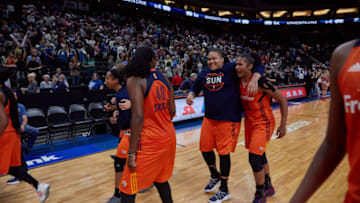 Members of the Connecticut Sun celebrate their fourth straight win at Xcel Energy Center. Photo by Abe Booker, III