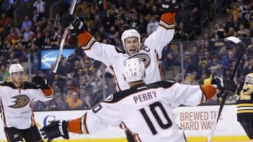 Mar 26, 2015; Boston, MA, USA; Anaheim Ducks center Ryan Getzlaf (15) celebrates with right wing Corey Perry (10) after scoring the game winning goal on Boston Bruins goalie Tuukka Rask (not pictured) during the overtime period at TD Banknorth Garden. The Anaheim Ducks won 3-2 in overtime. Mandatory Credit: Greg M. Cooper-USA TODAY Sports