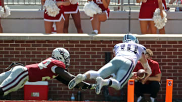 Sep 26, 2020; Norman, Oklahoma, USA; Kansas State Wildcats quarterback Skylar Thompson (10) dives for a touchdown past Oklahoma Sooners linebacker Brian Asamoah (24) during the second half at Gaylord Family Oklahoma Memorial Stadium. Mandatory Credit: Kevin Jairaj-USA TODAY Sports