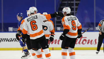Mar 29, 2021; Buffalo, New York, USA; Philadelphia Flyers defenseman Ivan Provorov (9) celebrates with teammates after scoring an overtime goal against the Buffalo Sabres at KeyBank Center. Mandatory Credit: Timothy T. Ludwig-USA TODAY Sports