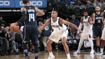 DALLAS, TX - JANUARY 9: Dennis Smith Jr. #1 of the Dallas Mavericks guards the Orlando Magic on January 9, 2018 at the American Airlines Center in Dallas, Texas. NOTE TO USER: User expressly acknowledges and agrees that, by downloading and or using this photograph, User is consenting to the terms and conditions of the Getty Images License Agreement. Mandatory Copyright Notice: Copyright 2018 NBAE (Photo by Glenn James/NBAE via Getty Images)
