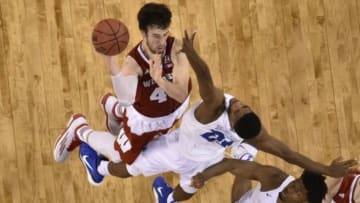 Apr 6, 2015; Indianapolis, IN, USA; Wisconsin Badgers forward Frank Kaminsky (44) shoots the ball against Duke Blue Devils forward Amile Jefferson (21) during the second half in the 2015 NCAA Men