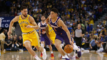 OAKLAND, CA - MARCH 10: Devin Booker #1 of the Phoenix Suns drives to the basket against Klay Thompson #11 of the Golden State Warriors at ORACLE Arena on March 10, 2019 in Oakland, California. NOTE TO USER: User expressly acknowledges and agrees that, by downloading and or using this photograph, User is consenting to the terms and conditions of the Getty Images License Agreement. (Photo by Lachlan Cunningham/Getty Images)