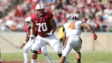Oct 25, 2014; Stanford, CA, USA; Stanford Cardinal offensive tackle Andrus Peat (70) prepares to block Oregon State Beavers linebacker D.J. Alexander (4) rush during the third quarter at Stanford Stadium. Stanford won 38-14. Mandatory Credit: Bob Stanton-USA TODAY Sports
