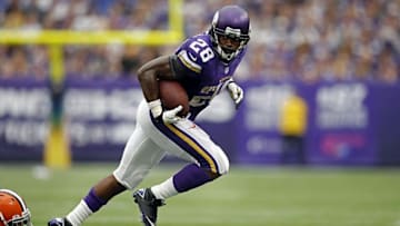 Sep 22, 2013; Minneapolis, MN, USA; Minnesota Vikings running back Adrian Peterson (28) rushes for 4 yards against the Cleveland Browns in the fourth quarter at Mall of America Field at H.H.H. Metrodome. The Browns win 31-27. Mandatory Credit: Bruce Kluckhohn-USA TODAY Sports