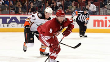 GLENDALE, AZ - APRIL 11: Sam Gagner #9 of the Arizona Coyotes skates the puck up ice while being chased by Hampus Lindholm #47 of the Anaheim Ducks during the second period at Gila River Arena on April 11, 2015 in Glendale, Arizona. (Photo by Norm Hall/NHLI via Getty Images)