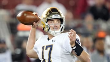 Nov 27, 2021; Stanford, California, USA; Notre Dame Fighting Irish quarterback Jack Coan (17) throws a pass during the third quarter against the Stanford Cardinal at Stanford Stadium. Mandatory Credit: Darren Yamashita-USA TODAY Sports