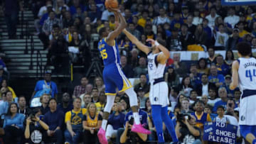 OAKLAND, CA - MARCH 23: Kevin Durant #35 of the Golden State Warriors shoots over Maximilian Kleber #42 of the Dallas Mavericks during an NBA basketball game at ORACLE Arena on March 23, 2019 in Oakland, California. NOTE TO USER: User expressly acknowledges and agrees that, by downloading and or using this photograph, User is consenting to the terms and conditions of the Getty Images License Agreement. (Photo by Thearon W. Henderson/Getty Images)