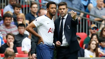 Tottenham Hotspur's Belgian midfielder Mousa Dembele (L) gets instructions from Tottenham Hotspur's Argentinian head coach Mauricio Pochettino before coming on as substitute during the English Premier League football match between Tottenham Hotspur and Fulham at Wembley Stadium in London, on August 18, 2018. (Photo by Ian KINGTON / AFP) / RESTRICTED TO EDITORIAL USE. No use with unauthorized audio, video, data, fixture lists, club/league logos or 'live' services. Online in-match use limited to 120 images. An additional 40 images may be used in extra time. No video emulation. Social media in-match use limited to 120 images. An additional 40 images may be used in extra time. No use in betting publications, games or single club/league/player publications. / (Photo credit should read IAN KINGTON/AFP/Getty Images)