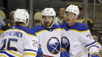 Oct 5, 2021; Pittsburgh, Pennsylvania, USA; Buffalo Sabres left wing Vinnie Hinostroza (29) celebrates with center Arttu Ruotsalainen (25) and right wing Victor Olofsson (71) after scoring a goal against the Pittsburgh Penguins during the first period at PPG Paints Arena. Mandatory Credit: Charles LeClaire-USA TODAY Sports