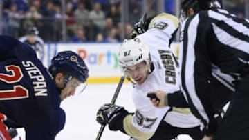 Mar 13, 2016; New York, NY, USA; Pittsburgh Penguins center Sidney Crosby (87) faces off against New York Rangers center Derek Stepan (21) during the thirdperiod at Madison Square Garden. The Penguins won 5-3. Mandatory Credit: Vincent Carchietta-USA TODAY Sports