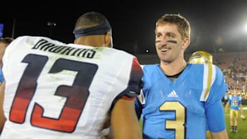 October 1, 2016; Pasadena, CA, USA; UCLA Bruins quarterback Josh Rosen (3) meets with Arizona Wildcats quarterback Brandon Dawkins (13) following the 45-24 victory at Rose Bowl. Mandatory Credit: Gary A. Vasquez-USA TODAY Sports