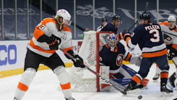 Mar 20, 2021; Uniondale, New York, USA; Philadelphia Flyers right wing Jakub Voracek (93) backhands the puck in front of New York Islanders goalie Ilya Sorokin (30) during the third period at Nassau Veterans Memorial Coliseum. Mandatory Credit: Brad Penner-USA TODAY Sports