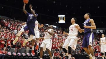 Feb 22, 2015; Pullman, WA, USA; Washington Huskies guard Mike Anderson (11) puts up a shot against Washington State Cougars guard DaVont Lacy (25) during the first half at Wallis Beasley Performing Arts Coliseum. Mandatory Credit: James Snook-USA TODAY Sports