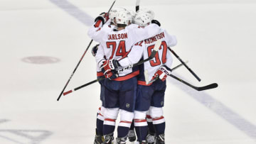 TAMPA, FL - MAY 11: Washington Capitals defender John Carlson (74) and teammates celebrate a power play goal by Washington Capitals left wing Alex Ovechkin (8) during the first period of the first game of the NHL Stanley Cup Eastern Conference Finals between the Washington Capitals and the Tampa Bay Lightning on May 11, 2018, at Amalie Arena in Tampa, FL. (Photo by Roy K. Miller/Icon Sportswire via Getty Images)