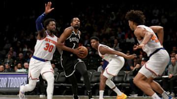 Nov 9, 2022; Brooklyn, New York, USA; Brooklyn Nets forward Kevin Durant (7) drives to the basket against New York Knicks forward Julius Randle (30) and guard RJ Barrett (9) and center Jericho Sims (45) during the third quarter at Barclays Center. Mandatory Credit: Brad Penner-USA TODAY Sports